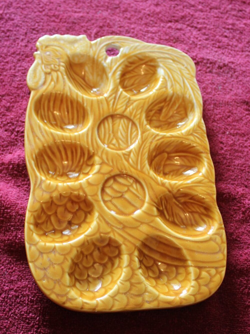 Vintage honey-yellow ceramic hen deviled egg platter featuring a glossy, textur